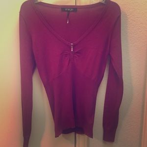 Long sleeve Fuchsia sweater.